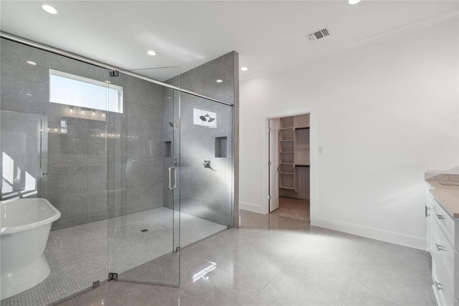 Bathroom with independent shower and bath, vanity, and tile patterned floors