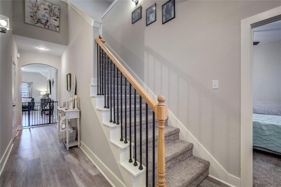 Stairway with hardwood / wood-style floors