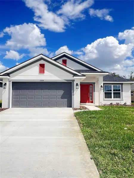 Front exterior of a new home in , Dade City, FL, highlighting curb appeal (Image 1). Front exterior of a new home in , Dade City, FL, highlighting curb appeal (Image 1).