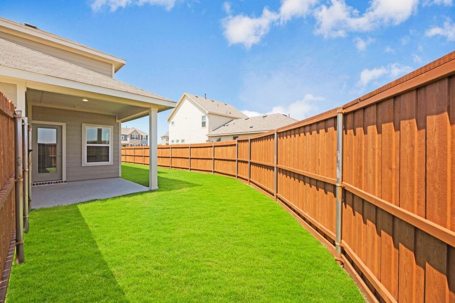 Representative exterior photo of a completed home built from the Lockhart by Impression Homes in Heartland, Heartland, TX (Image 29). Representative exterior photo of a completed home built from the Lockhart by Impression Homes in Heartland, Heartland, TX (Image 29).