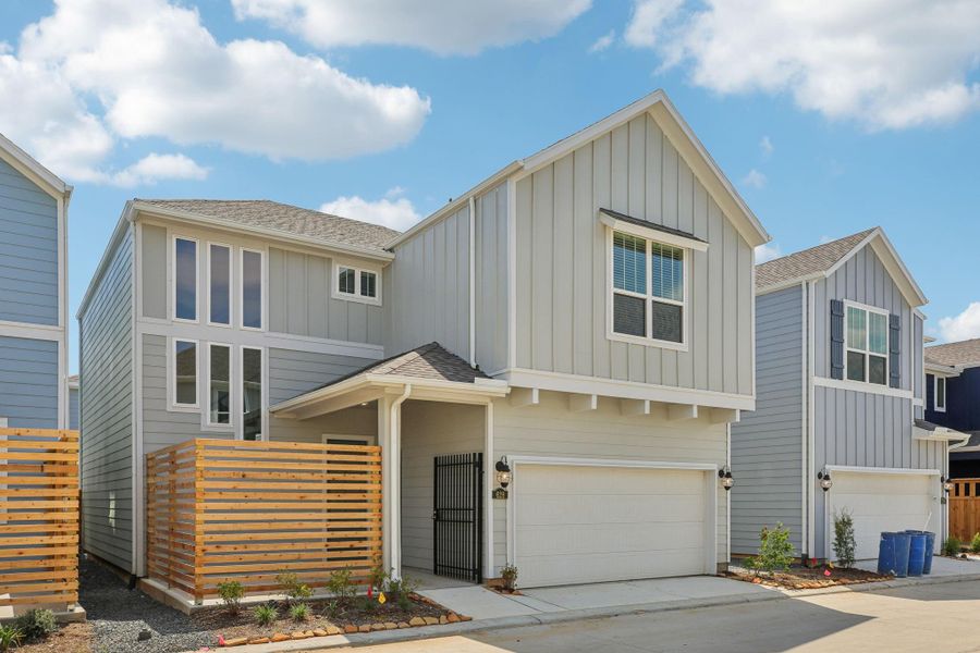 Front exterior of a new home in Kemah Crossing - Luxe Series, Kemah, TX, highlighting curb appeal (Image 20). Front exterior of a new home in Kemah Crossing - Luxe Series, Kemah, TX, highlighting curb appeal (Image 20).