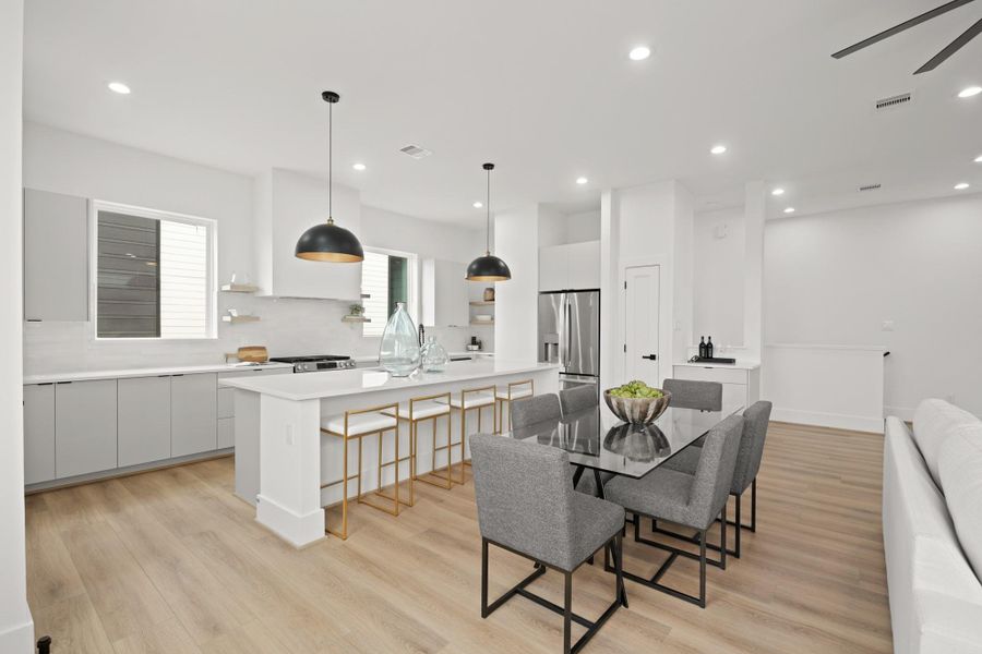 Imagine preparing your favorite meals and recipes in this thoughtfully planned kitchen while your guests mingle about the oversized island and nearby living spaces. Imagine preparing your favorite meals and recipes in this thoughtfully planned kitchen while your guests mingle about the oversized island and nearby living spaces.