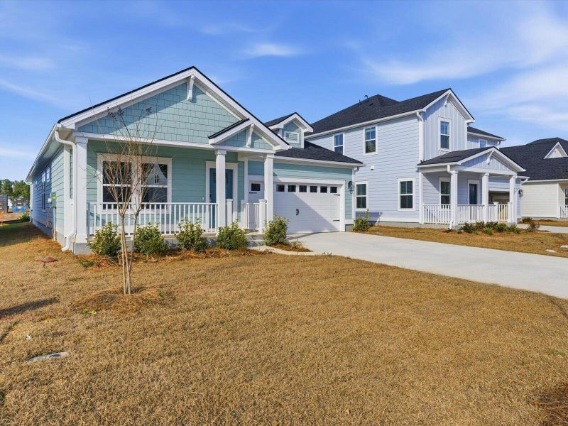 Front exterior of a new home in The Coves at Lakes of Cane Bay, Summerville, SC, highlighting curb appeal (Image 26).