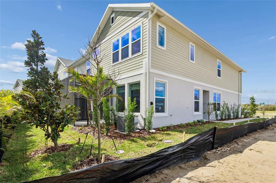 Exterior details and patio area of a home in North River Ranch – Townhomes, Parrish (Image 25).