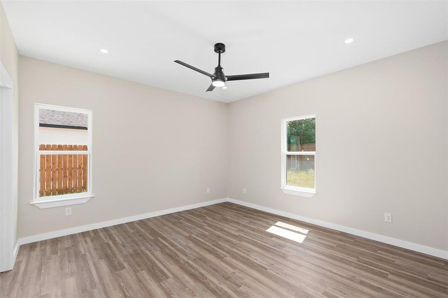 Unfurnished room featuring light wood-style floors, recessed lighting, and ceiling fan