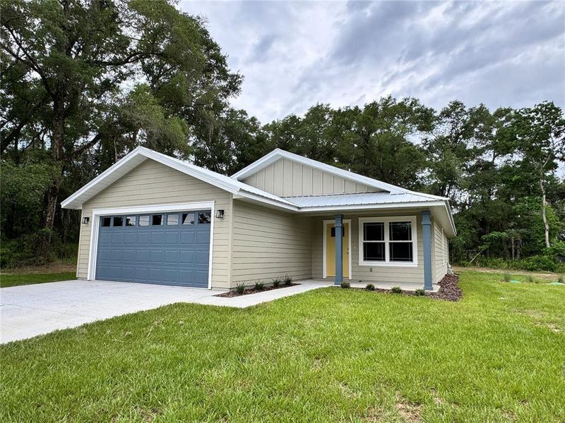 Front exterior of a new home in , Trenton, FL, highlighting curb appeal (Image 1). Front exterior of a new home in , Trenton, FL, highlighting curb appeal (Image 1).