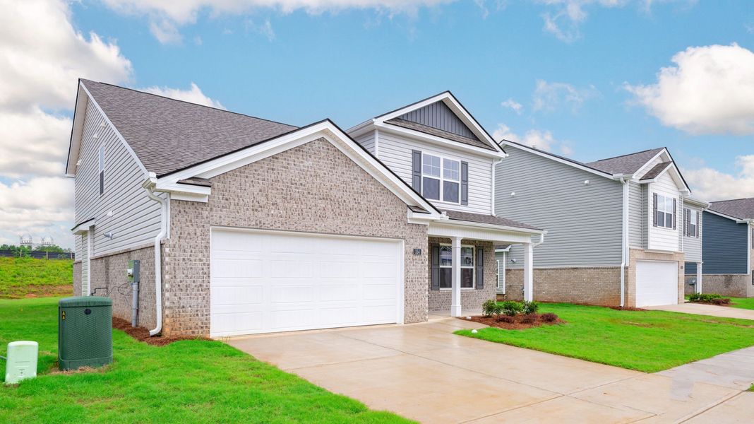 Front exterior of a new home in Price's Crossing, LaFayette, GA, highlighting curb appeal (Image 2).