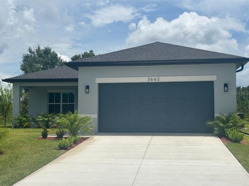 Front exterior of a new home in , North Port, FL, highlighting curb appeal (Image 18). Front exterior of a new home in , North Port, FL, highlighting curb appeal (Image 18).