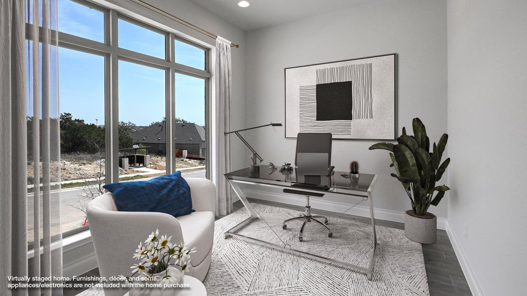 Home office featuring a wealth of natural light, recessed lighting, wood finished floors, and baseboards Home office featuring a wealth of natural light, recessed lighting, wood finished floors, and baseboards