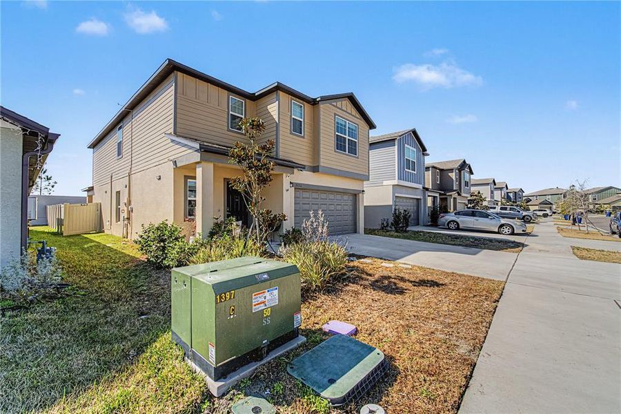 Front exterior of a new home in Two Rivers, Zephyrhills, FL, highlighting curb appeal (Image 20).