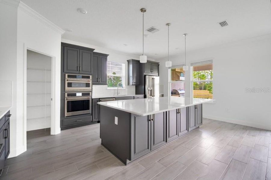 Furnished interior view inside a new home in Harvest at Ovation, Winter Garden (Image 25).