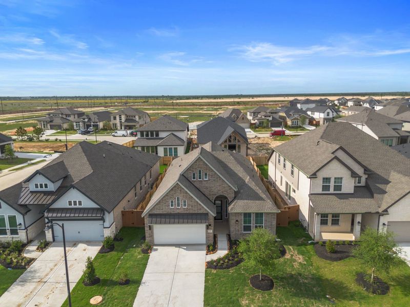 Representative exterior photo of a completed home built from the Summerton 50′ Lot by Chesmar Homes in Meridiana, Manvel, TX (Image 19). Representative exterior photo of a completed home built from the Summerton 50′ Lot by Chesmar Homes in Meridiana, Manvel, TX (Image 19).