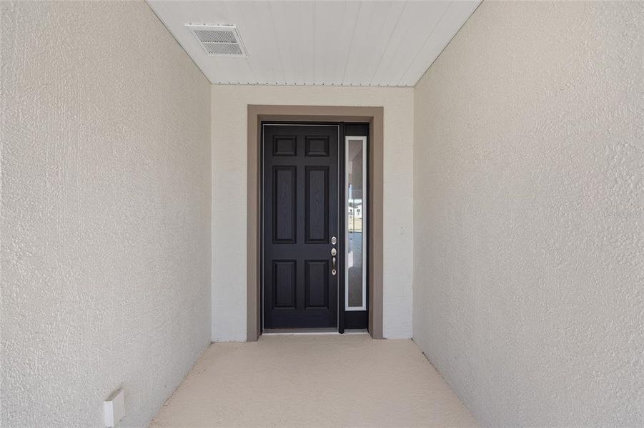 Exterior details and patio area of a home in Calesa Township, Ocala (Image 3).