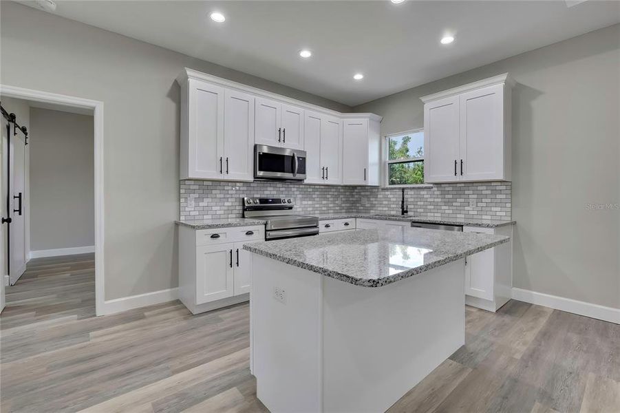 Furnished interior view inside a new home in , Dade City (Image 12).