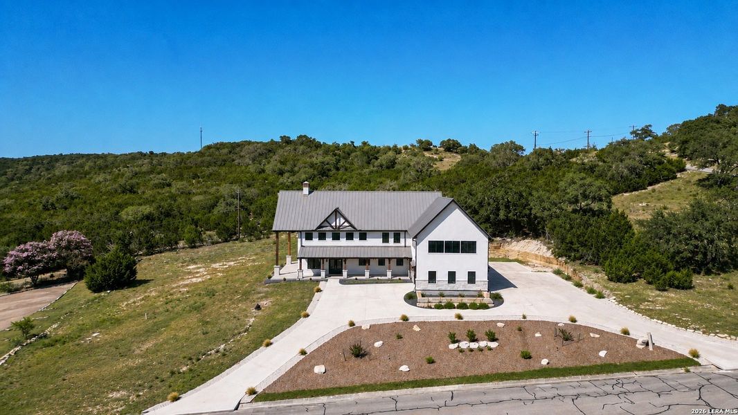 Front exterior of a new home in , Boerne, TX, highlighting curb appeal (Image 25). Front exterior of a new home in , Boerne, TX, highlighting curb appeal (Image 25).