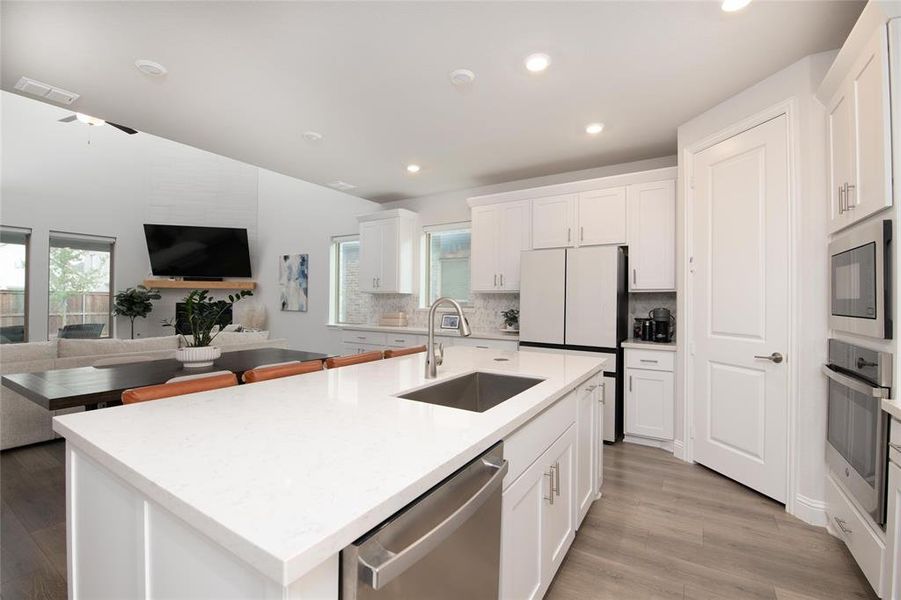 At the heart of the home, the gourmet kitchen seamlessly connects to the dining area and gathering room, creating an ideal space for everyday living and effortless entertaining. At the heart of the home, the gourmet kitchen seamlessly connects to the dining area and gathering room, creating an ideal space for everyday living and effortless entertaining.