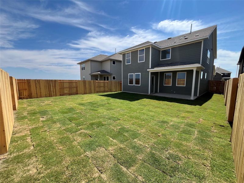 Front exterior of a new home in The Homestead at Lariat, Liberty Hill, TX, highlighting curb appeal (Image 14). Front exterior of a new home in The Homestead at Lariat, Liberty Hill, TX, highlighting curb appeal (Image 14).