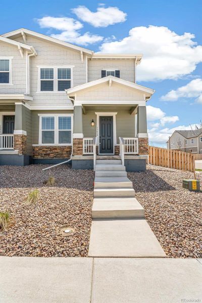 Front exterior of a new home in Turnberry, Commerce City, CO, highlighting curb appeal (Image 22). Front exterior of a new home in Turnberry, Commerce City, CO, highlighting curb appeal (Image 22).