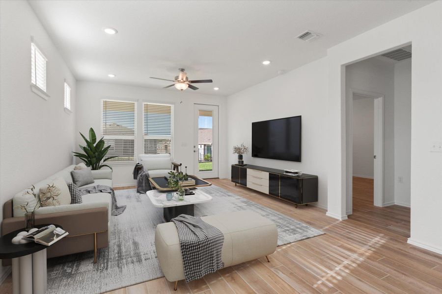 Virtual Staging Living room featuring healthy amount of natural light, recessed lighting, light wood finished floors, and ceiling fan