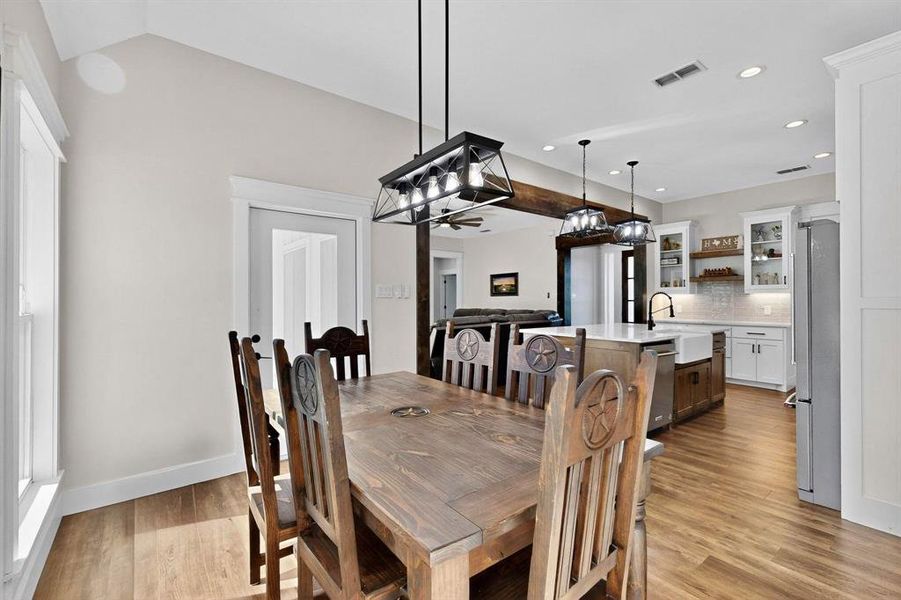 Dining space featuring light wood finished floors, recessed lighting, and plenty of natural light