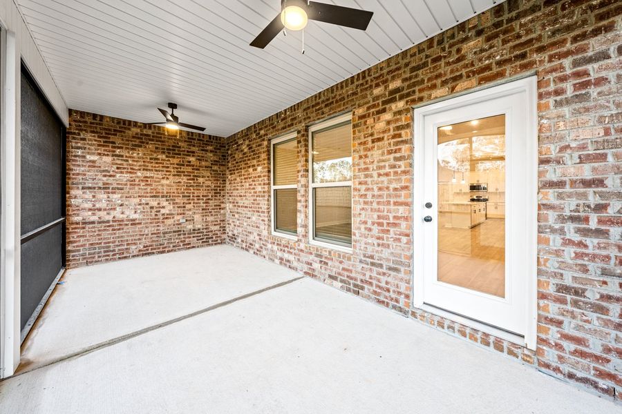 Exterior details and patio area of a home in Bird Song at Hammock Bay, Freeport (Image 3).