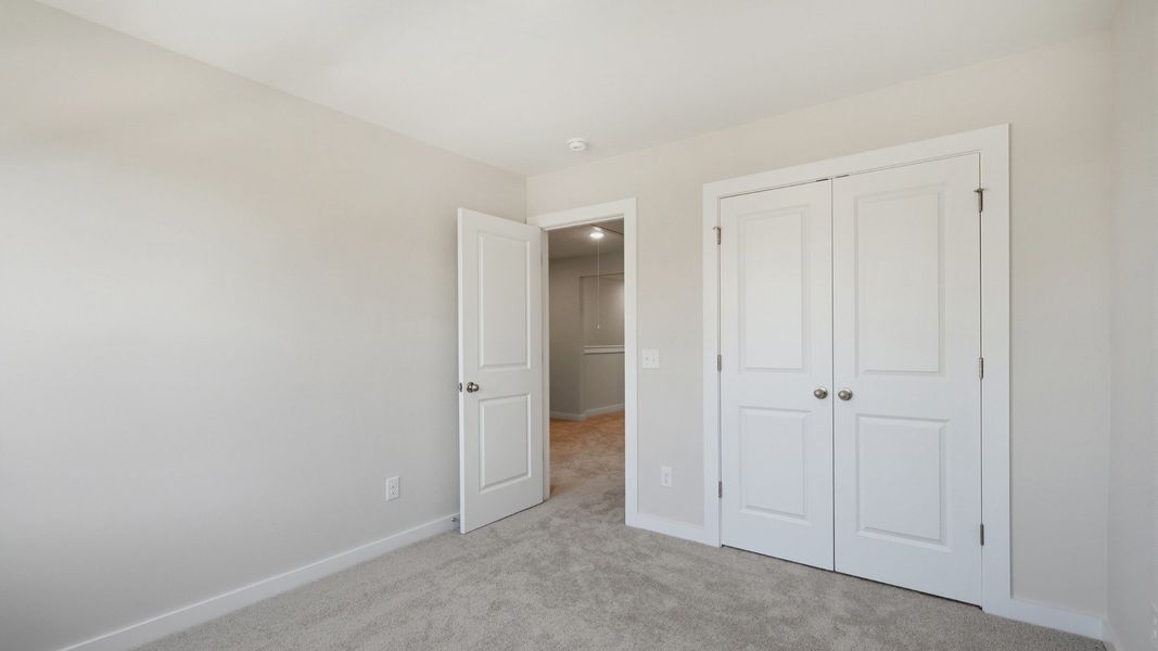 Secondary bedroom with double door closet for storage options