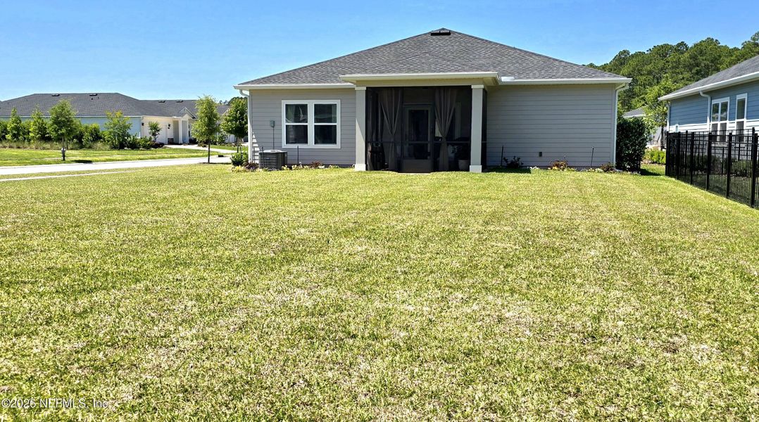 Exterior details and patio area of a home in Edenbrooke at Hyland Trail | 55+, Green Cove Springs (Image 24).