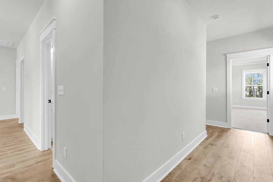 Spacious, unfurnished interior of a new home in Tidewater at Lakes of Cane Bay, Summerville (Image 50).