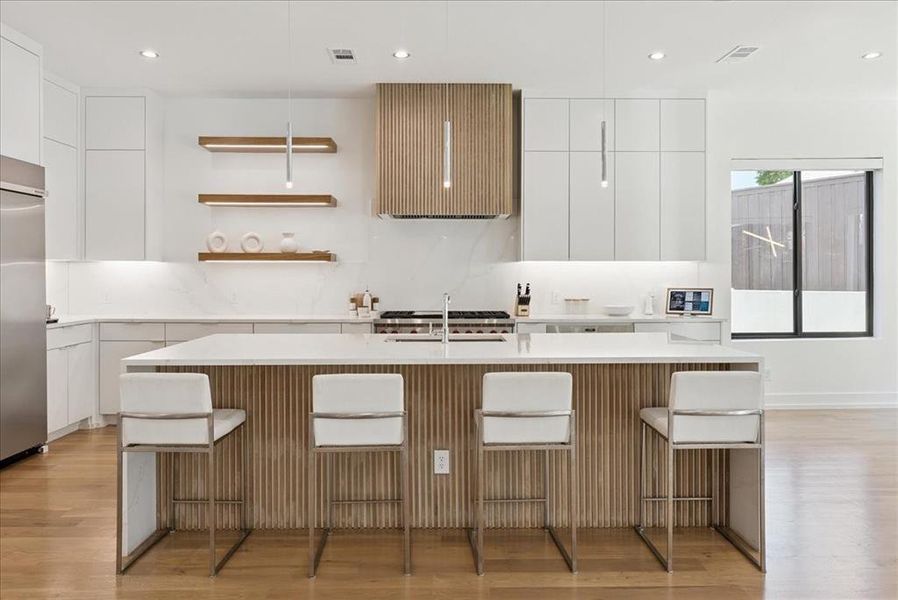 Kitchen featuring modern cabinets, open shelves, white cabinetry, recessed lighting, and light wood-style flooring