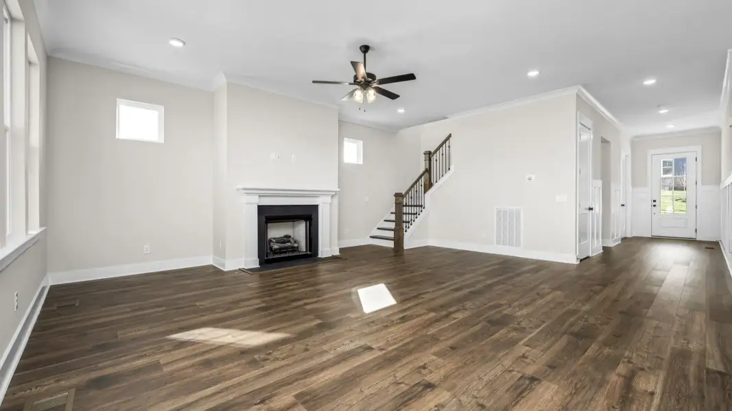 Spacious living area with elevated fireplace feature
