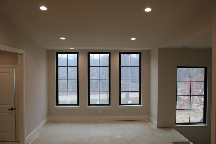 Spare room featuring lofted ceiling