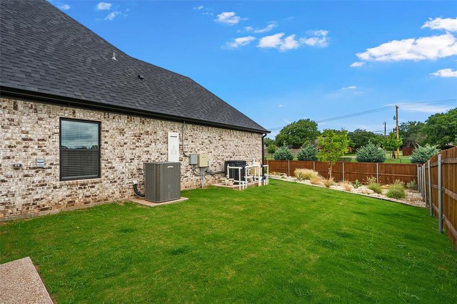 Exterior details and patio area of a home in , Woodway (Image 22).