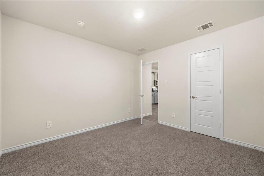 bedroom with baseboards and carpet flooring bedroom with baseboards and carpet flooring