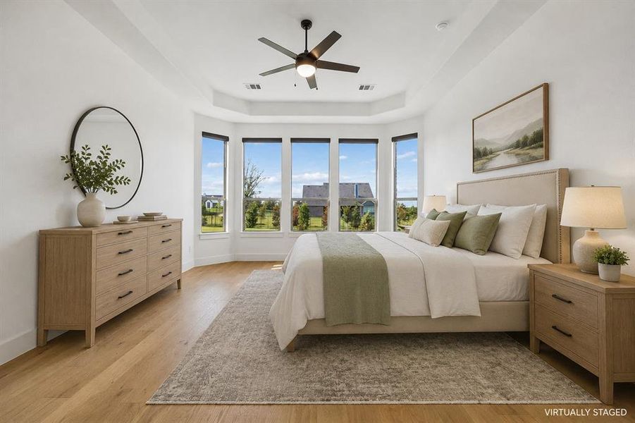 The primary suite is tucked away in the back of the home and creates the perfect peaceful retreat.