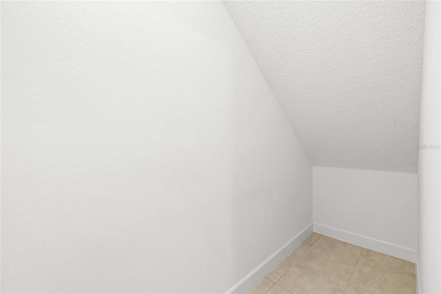 Spacious, unfurnished interior of a new home in Harvest At Ovation 50s, Winter Garden (Image 33).