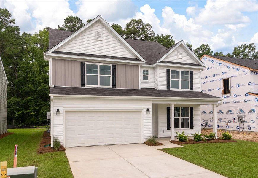 Front exterior of a new home in Oakley Pointe, Moncks Corner, SC, highlighting curb appeal (Image 2). Front exterior of a new home in Oakley Pointe, Moncks Corner, SC, highlighting curb appeal (Image 2).