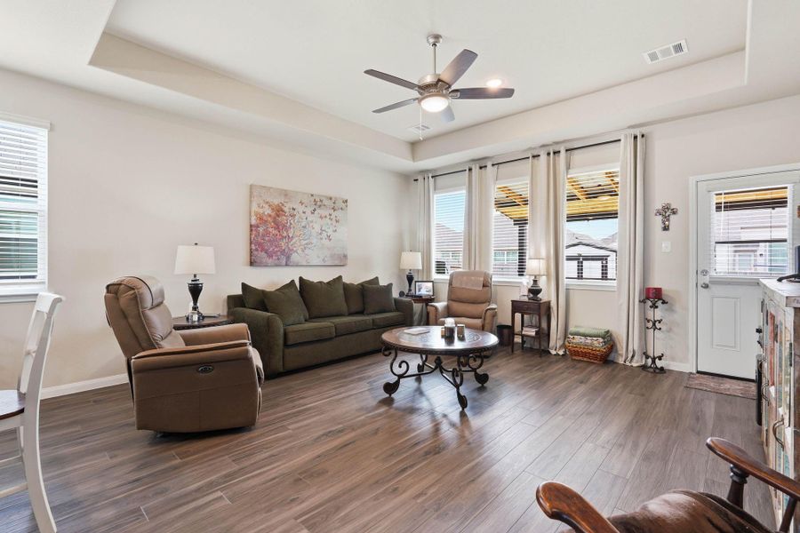 Family room features a wall of windows