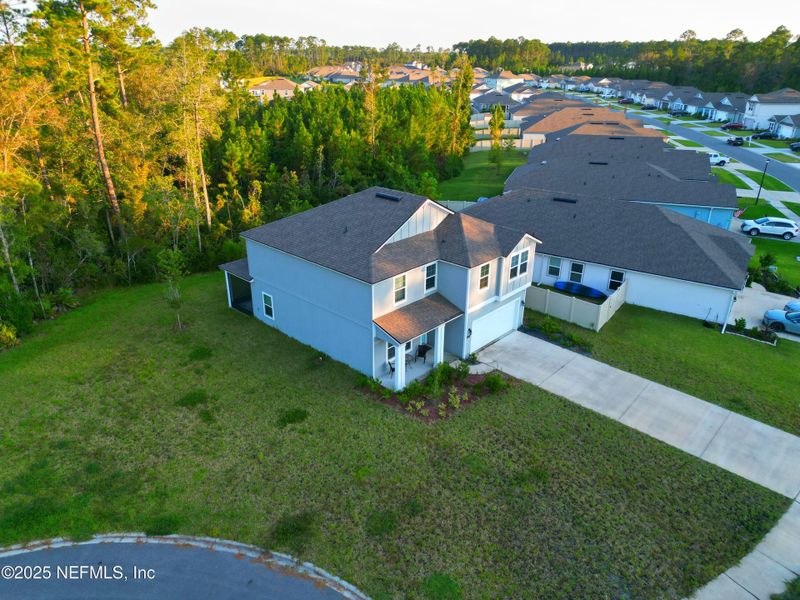 Front exterior of a new home in River Glen, Yulee, FL, highlighting curb appeal (Image 1).