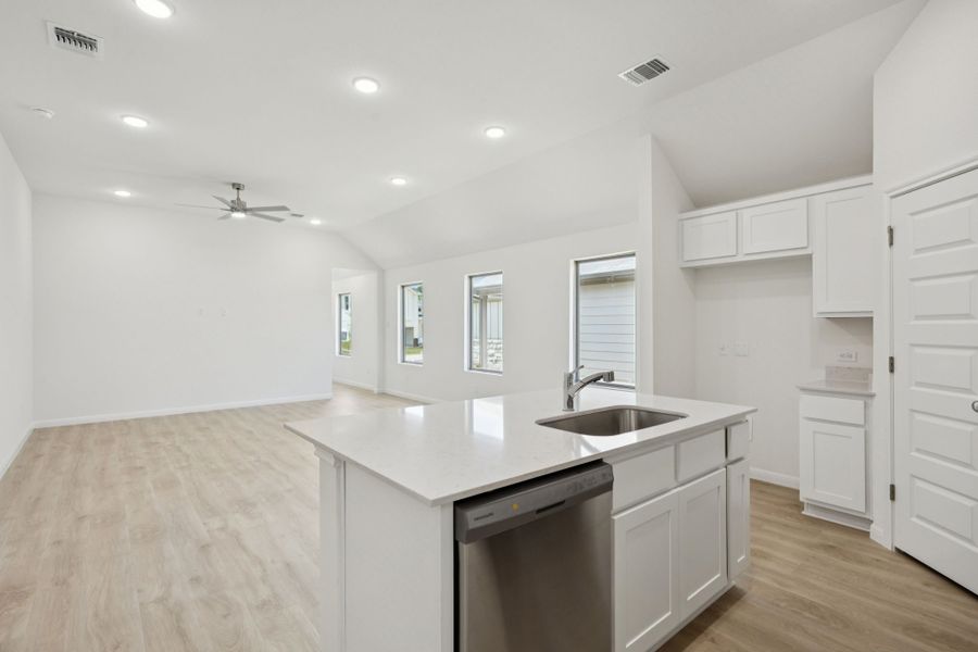 Kitchen in the Cypress home plan by Trophy Signature Homes - REPRESENTATIVE PHOTO