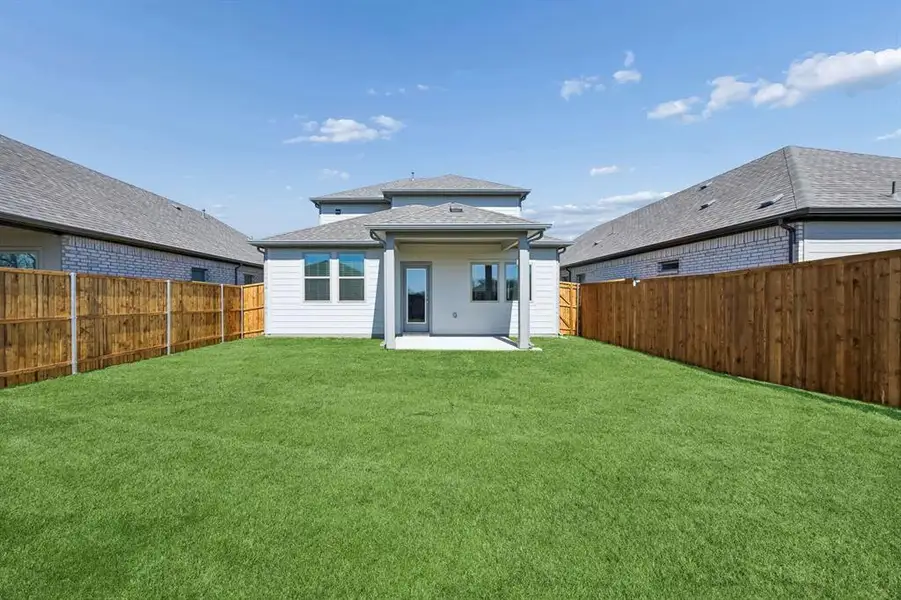Covered Patio in the Mesquite home plan by Trophy Signature Homes – REPRESENTATIVE PHOTO