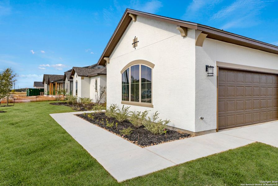 Exterior details and patio area of a home in Pradera Ridge, Floresville (Image 3). Exterior details and patio area of a home in Pradera Ridge, Floresville (Image 3).