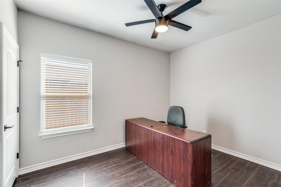 Office area featuring dark wood-style floors and ceiling fan Office area featuring dark wood-style floors and ceiling fan
