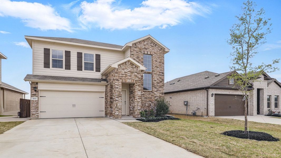 Representative exterior photo of a completed home built from the MACON by D.R. Horton in Springhill South, Boyd, TX (Image 20). Representative exterior photo of a completed home built from the MACON by D.R. Horton in Springhill South, Boyd, TX (Image 20).