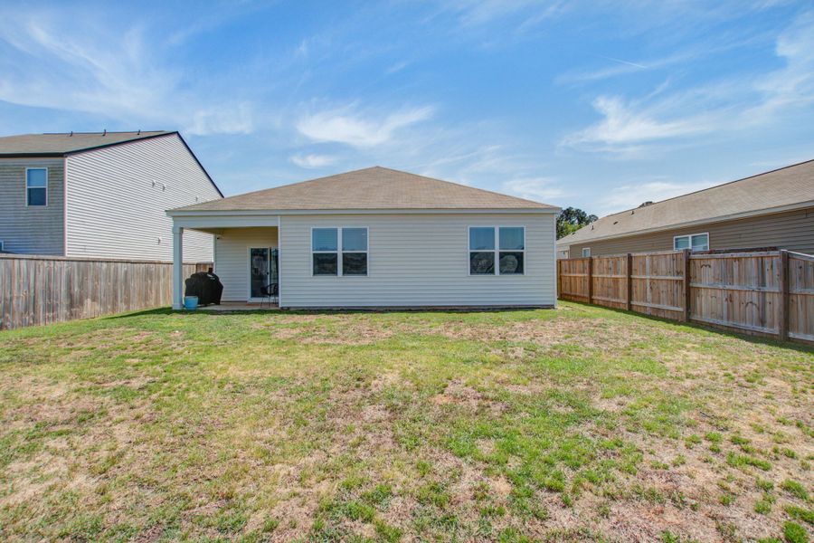 Exterior details and patio area of a home in Pine Hills at Cane Bay, Summerville (Image 26).