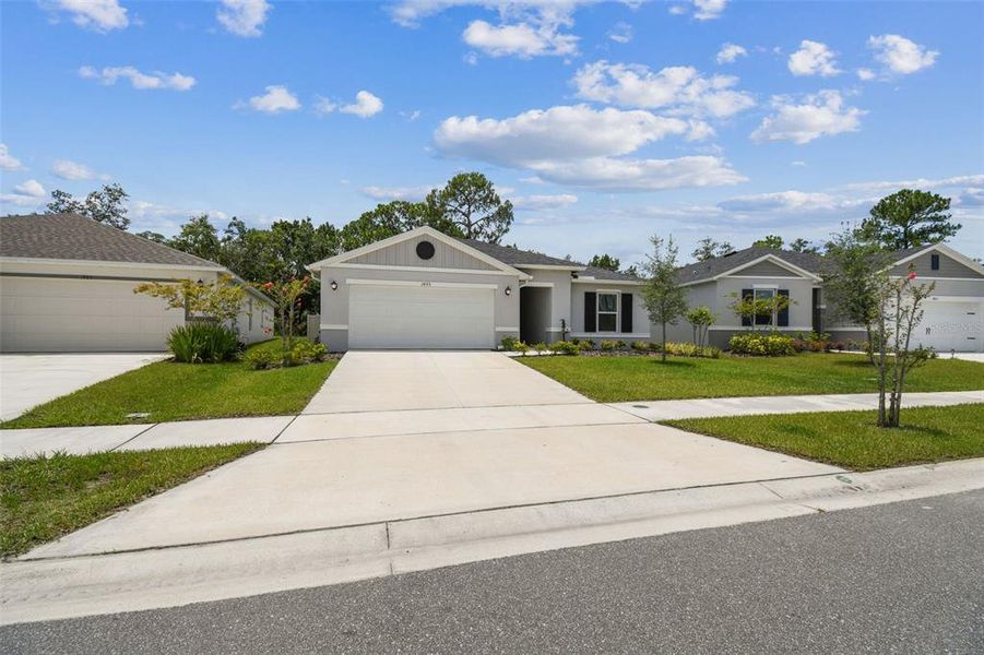 Front exterior of a new home in , Titusville, FL, highlighting curb appeal (Image 26).