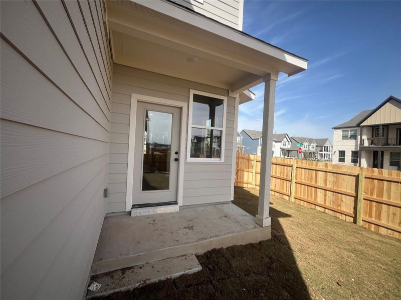Exterior details and patio area of a home in Lariat, Liberty Hill (Image 11).