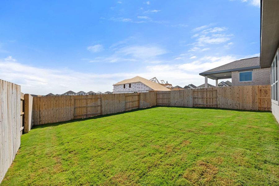 Exterior details and patio area of a home in Lariat, Liberty Hill (Image 26).