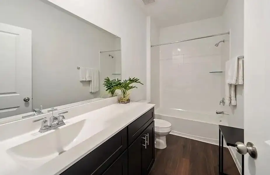 Furnished interior view inside a new home in The Pines At Seven Coves, Conroe (Image 7).