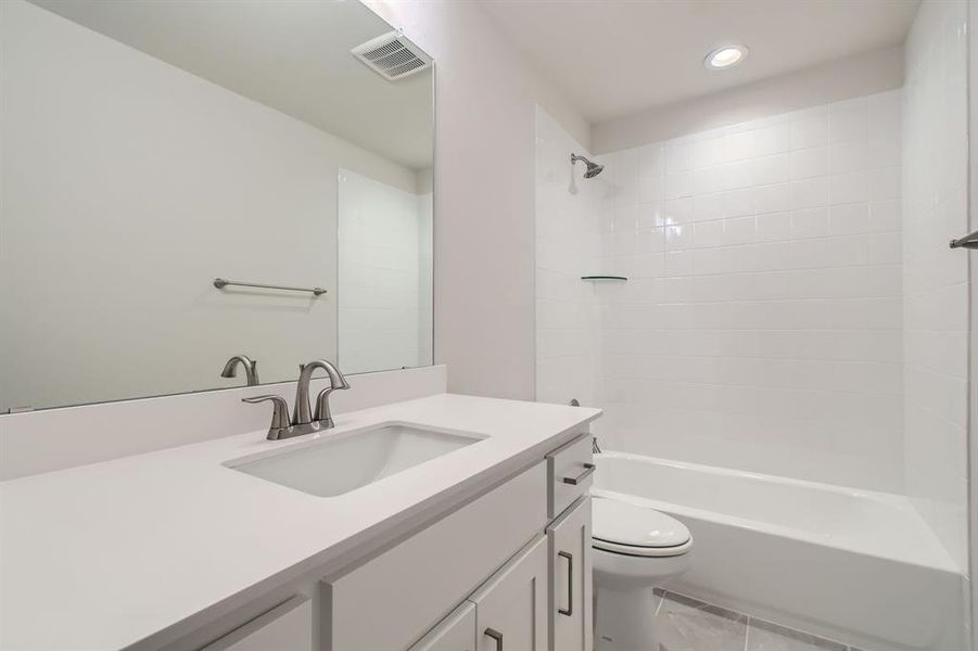 Full bathroom with vanity, recessed lighting, and bathtub / shower combination Full bathroom with vanity, recessed lighting, and bathtub / shower combination