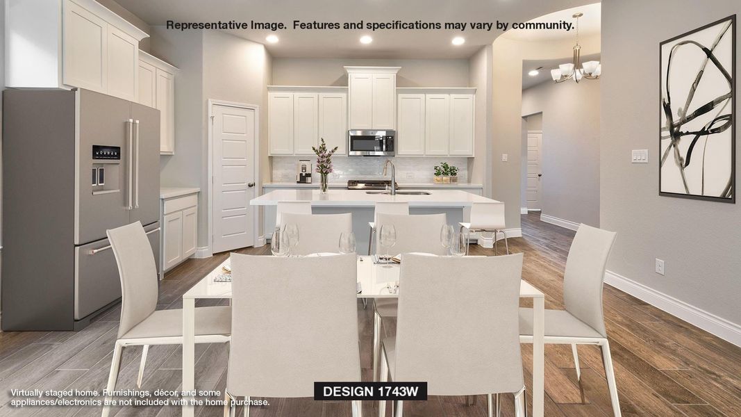 Dining space with sink, hardwood / wood-style floors, and an inviting chandelier